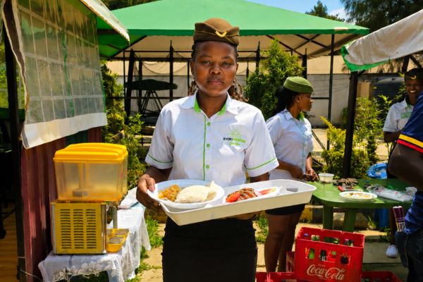 Waiter serving guests at Syoki Greenpark Gardens